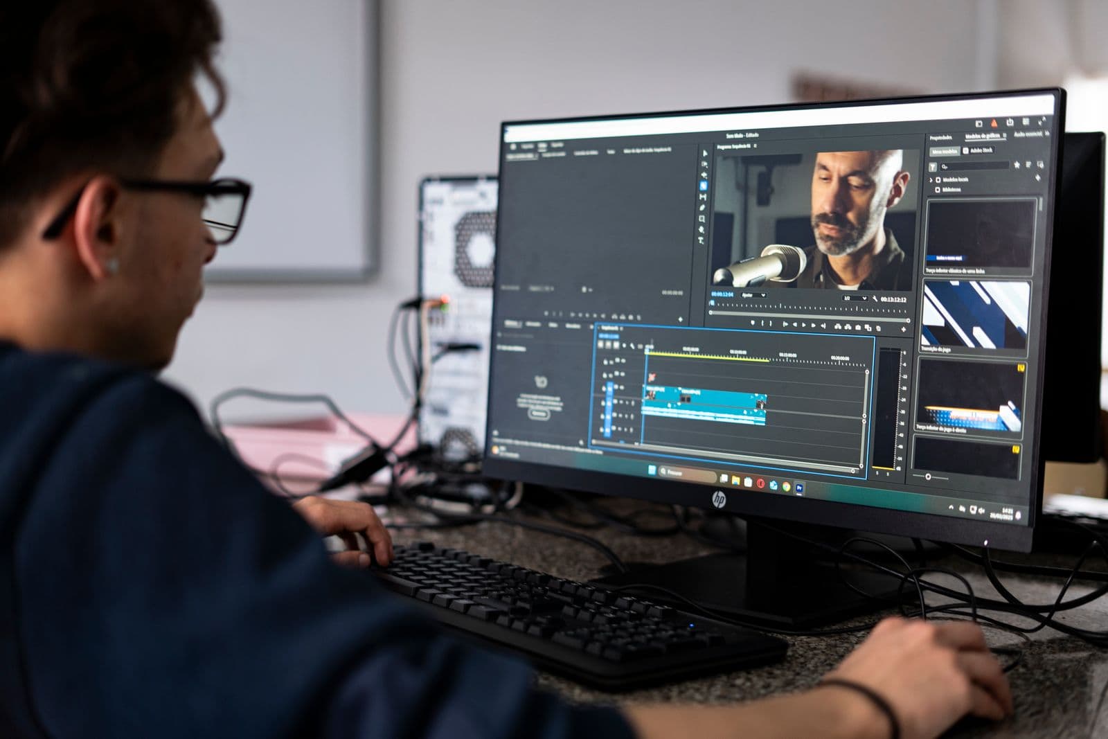 Video editing footage and timelines on a desktop workstation